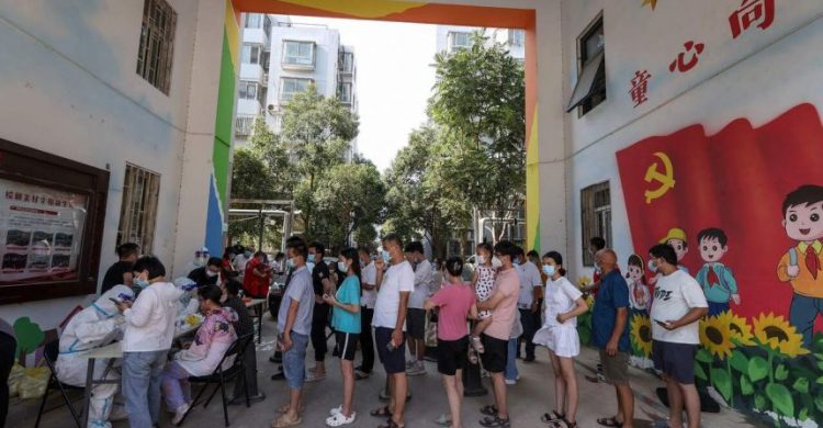 Chinese cities test millions as Covid-19 cases surge
