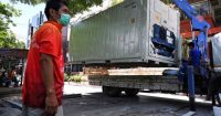 As Covid-19 cases surge, Thai hospital uses containers to store bodies